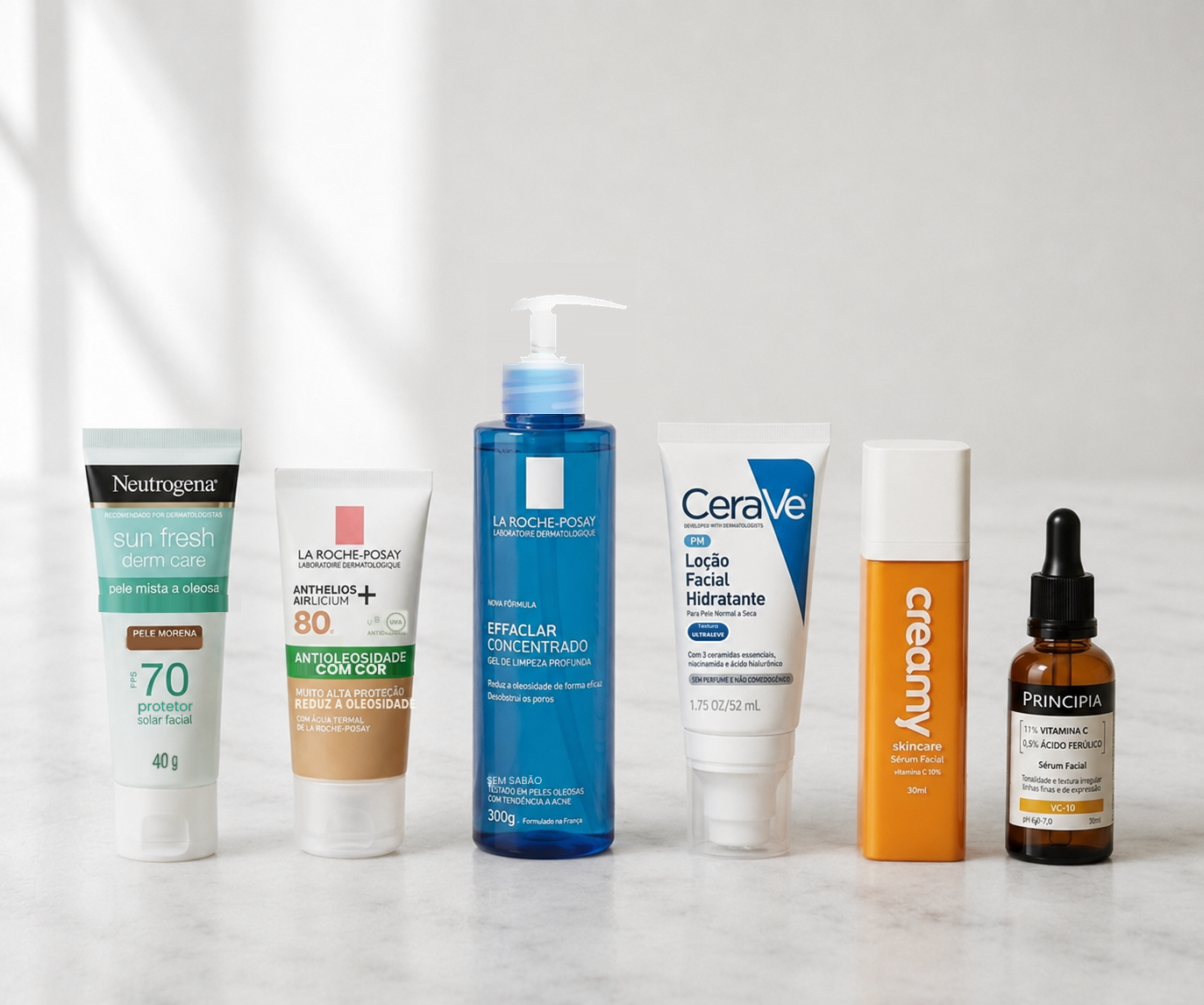 Rotina de skincare para pele negra e multirracial: protetor solar, limpeza, hidratação e sérum de vitamina C lado a lado